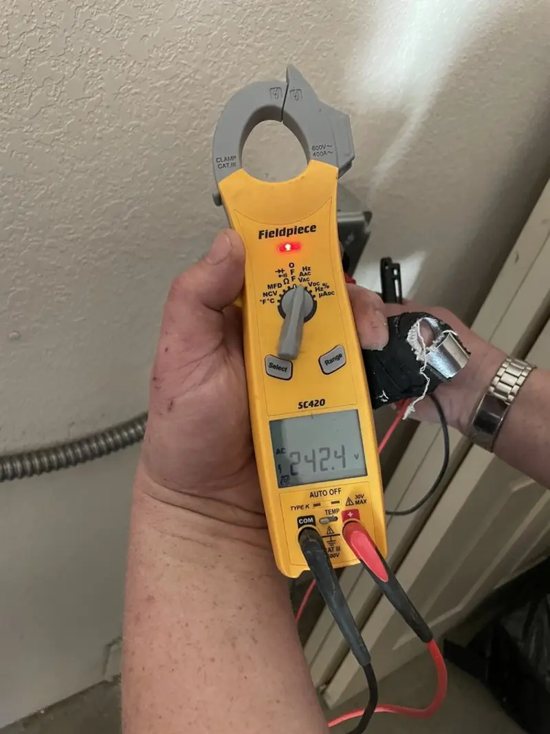 Voltage testing with clamp meter during Generator Installation in Lake Darby